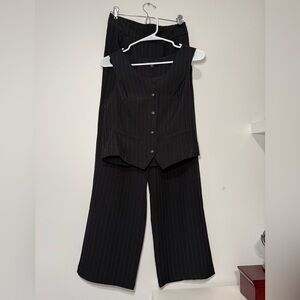 Sophisticated Black Pinstripe Pantsuit by [Brand]